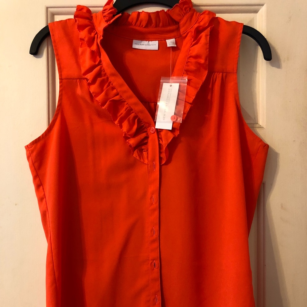Orange ruffled blouse